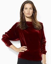 A timeless tunic is rendered in soft, lustrous velvet with a flattering boat neckline for sophisticated cold-weather style. A timeless tunic is rendered in soft, lustrous velvet with a flattering boat neckline for sophisticated cold-weather style.