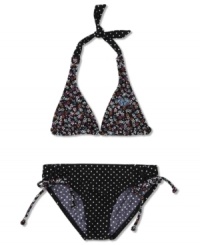 Sunny style. Give her look a fun turn with this print halter top and bottoms two-piece swimsuit from Roxy. Sunny style. Give her look a fun turn with this print halter top and bottoms two-piece swimsuit from Roxy.
