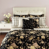 Silhouetted blossoms cascade across a bold black ground with hints of sage, pale yellow and rose on duvets, comforters and shams in this classic bedding collection. Silhouetted blossoms cascade across a bold black ground with hints of sage, pale yellow and rose on duvets, comforters and shams in this classic bedding collection.