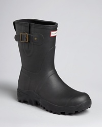 Stomp through any storm with these rugged rubber boots from Hunter, an original design that keeps your feet dry and comfortable no matter how harsh the rain or snow. Stomp through any storm with these rugged rubber boots from Hunter, an original design that keeps your feet dry and comfortable no matter how harsh the rain or snow.