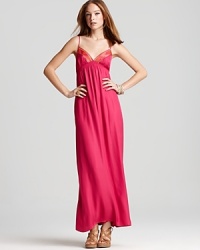 Channel high-end hippie style in this Twelfth Street by Cynthia Vincent maxi slip dress featuring a flattering empire waist and Southwestern-inspired embroidered neckline. Channel high-end hippie style in this Twelfth Street by Cynthia Vincent maxi slip dress featuring a flattering empire waist and Southwestern-inspired embroidered neckline.