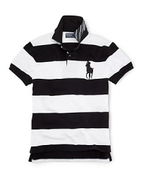 Cut for a trim, athletic-looking fit from breathable cotton mesh, an iconic short-sleeved polo shirt makes a sporty statement with bold stripes. Cut for a trim, athletic-looking fit from breathable cotton mesh, an iconic short-sleeved polo shirt makes a sporty statement with bold stripes.