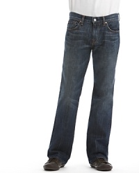 Five pocket bootcut jeans that sit low on the waist. Back pocket features 7 for All Mankind's signature squiggle embroidery. In a dark, inky blue wash with slight fading and distressing. Zip fly and button closure. Five pocket bootcut jeans that sit low on the waist. Back pocket features 7 for All Mankind's signature squiggle embroidery. In a dark, inky blue wash with slight fading and distressing. Zip fly and button closure.