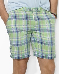 A versatile essential for every warm-weather wardrobe, a soft cotton chino short features one solid side and one madras side for a timeless, preppy look. A versatile essential for every warm-weather wardrobe, a soft cotton chino short features one solid side and one madras side for a timeless, preppy look.