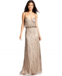 Adrianna Papell's petite blouson-style gown is radiant with shimmering beading and spaghetti straps that elegantly crisscross at the back. Adrianna Papell's petite blouson-style gown is radiant with shimmering beading and spaghetti straps that elegantly crisscross at the back.