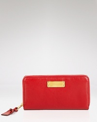 This Marc Jacobs wallet is a major essential, crafted of pristine leather. The zip around design opens to a lined interior, divided by a zip compartment and outfitted with sixteen credit card slots. This Marc Jacobs wallet is a major essential, crafted of pristine leather. The zip around design opens to a lined interior, divided by a zip compartment and outfitted with sixteen credit card slots.