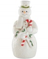 With a smile frozen on his face, a giant candy cane and quaint holly accents, this sweet snowman figurine coordinates beautifully with classic Holiday decor by Lenox.