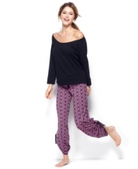 Comfortable cuteness is all yours. Material Girl's sweatshirt has a large round neck and lace inserts at the sides while the baggy lounge pants feature an all-over Aztec patten. Comfortable cuteness is all yours. Material Girl's sweatshirt has a large round neck and lace inserts at the sides while the baggy lounge pants feature an all-over Aztec patten.