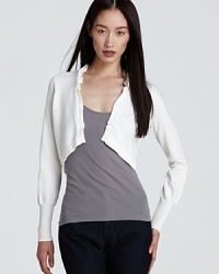 The perfect foil to this season's brights, this T Tahari sweater lends a lightweight layer to all your summer essentials. The perfect foil to this season's brights, this T Tahari sweater lends a lightweight layer to all your summer essentials.