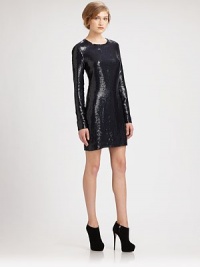 Stunning A-line shift dress lacquered in glimmering sequins, finished with long sleeves and zippered cuffs. RoundneckLong sleeves with zippered cuffsBack zipperAbout 21 from natural waistSequined polyesterDry cleanImportedModel shown is 5'10 (177cm) wearing US size 4. Stunning A-line shift dress lacquered in glimmering sequins, finished with long sleeves and zippered cuffs. RoundneckLong sleeves with zippered cuffsBack zipperAbout 21 from natural waistSequined polyesterDry cleanImportedModel shown is 5'10 (177cm) wearing US size 4.