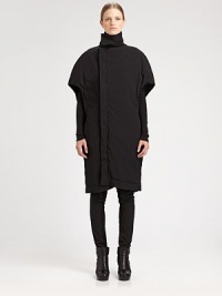 Sculptural and modern, finished with unique cape sleeves and side slash pockets.Funnel collarShort cape sleevesAsymmetrical concealed button frontSide slash pocketsAbout 42 from shoulder to hem97% cotton/3% spandexDry cleanMade in Italy of imported fabricModel shown is 5'10½ (179cm) wearing US size Small. 