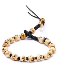 A spirited design from Chan Luu features antique bone carved into skulls, threaded together for a bold, masculine accessory. A spirited design from Chan Luu features antique bone carved into skulls, threaded together for a bold, masculine accessory.