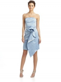 An elegantly draped oversized rose lends a whimsical tone to this simple bustier design.Straight neckline Boned bodice and sides Slim belt with oversize rose and draped wrap skirt Back zipper Fully lined About 44 from shoulder to hem Polyester; dry clean Imported An elegantly draped oversized rose lends a whimsical tone to this simple bustier design.Straight neckline Boned bodice and sides Slim belt with oversize rose and draped wrap skirt Back zipper Fully lined About 44 from shoulder to hem Polyester; dry clean Imported