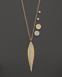 A diamond-embellished leaf pendant necklace in yellow gold from Meira T. A diamond-embellished leaf pendant necklace in yellow gold from Meira T.