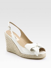 Adjustable, patent leather slingback with an espadrille wedge and unique bow embellishment. Stacked rope wedge, 4 (100mm)Covered platform, 1 (25mm)Compares to a 3 heel (75mm)Patent leather upperLeather liningRubber solePadded insoleMade in ItalyOUR FIT MODEL RECOMMENDS ordering one half size up as this style runs small. Adjustable, patent leather slingback with an espadrille wedge and unique bow embellishment. Stacked rope wedge, 4 (100mm)Covered platform, 1 (25mm)Compares to a 3 heel (75mm)Patent leather upperLeather liningRubber solePadded insoleMade in ItalyOUR FIT MODEL RECOMMENDS ordering one half size up as this style runs small.