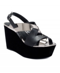 Tall tale. Scale new stylistic heights in the Laffie platform sandals by BCBGeneration. With a covered platform and towering wedge heel, they feature chic criss-crossing straps. Tall tale. Scale new stylistic heights in the Laffie platform sandals by BCBGeneration. With a covered platform and towering wedge heel, they feature chic criss-crossing straps.