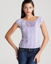 A soft purple Nanette Lepore top features a gingham print and lace inset for country chic that pairs with the season's must-have floral trend for unexpected femininity. A soft purple Nanette Lepore top features a gingham print and lace inset for country chic that pairs with the season's must-have floral trend for unexpected femininity.