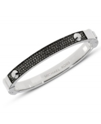 Sleek style that begs to be stacked. This hinge bracelet by Michael Kors embellishes a classic bangle with pave-set glass accents. Crafted in silver tone mixed metal. Approximate diameter: 2-1/4 inches. Sleek style that begs to be stacked. This hinge bracelet by Michael Kors embellishes a classic bangle with pave-set glass accents. Crafted in silver tone mixed metal. Approximate diameter: 2-1/4 inches.