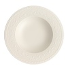 This collection of classic white, patterned dinnerware and serveware is remarkable for its ability to coordinate with a variety of table linen and flatware patterns.