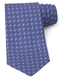 Signature Gancini logos are banded by stripes for an alluring pattern on this handsome Salvatore Ferragamo silk tie. Signature Gancini logos are banded by stripes for an alluring pattern on this handsome Salvatore Ferragamo silk tie.