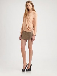Subtle draping lends this modern silk silhouette a relaxed, romantic air.V-neckWrap front with hook-and-eye closureLong sleeves with button cuffsBack pleatAbout 22 from shoulder to hemSilkDry cleanImportedModel shown is 5'10 (177cm) wearing US size Small. Subtle draping lends this modern silk silhouette a relaxed, romantic air.V-neckWrap front with hook-and-eye closureLong sleeves with button cuffsBack pleatAbout 22 from shoulder to hemSilkDry cleanImportedModel shown is 5'10 (177cm) wearing US size Small.