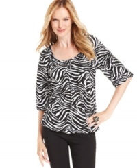 MICHAEL Michael Kors' petite top features a stylish zebra print and billowy blouson-style fit. Perfect for pairing with skirts, pants, jeans and more! MICHAEL Michael Kors' petite top features a stylish zebra print and billowy blouson-style fit. Perfect for pairing with skirts, pants, jeans and more!