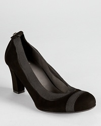 Easy and effortless, these Stuart Weitzman pumps slip on and go in soft black suede with elastic trim. Easy and effortless, these Stuart Weitzman pumps slip on and go in soft black suede with elastic trim.
