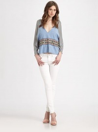 Airy jersey and chambray in a draped dolman pullover accented with woven tribal-print trim.V necklineDropped shouldersDolman sleevesAbout 23 from shoulder to hemViscoseDry cleanImportedModel shown is 5'10 (177cm) wearing US size Small. Airy jersey and chambray in a draped dolman pullover accented with woven tribal-print trim.V necklineDropped shouldersDolman sleevesAbout 23 from shoulder to hemViscoseDry cleanImportedModel shown is 5'10 (177cm) wearing US size Small.