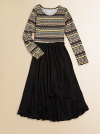 An airy hi-lo hem adds a trendy touch to a simply stunning frock with a colorful, swirly design.ScoopneckLong sleevesPullover styleHi-lo hem85% rayon/15% spandexHand washImported An airy hi-lo hem adds a trendy touch to a simply stunning frock with a colorful, swirly design.ScoopneckLong sleevesPullover styleHi-lo hem85% rayon/15% spandexHand washImported