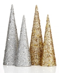 Simply dazzling, these streamlined trees set the scene for a festive holiday with silver glitter and sequins. Simply dazzling, these streamlined trees set the scene for a festive holiday with silver glitter and sequins.