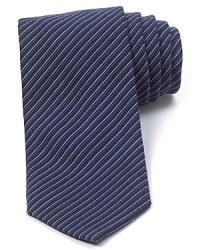 Thin tonal stripes augment your handsome professional look with this soft tie cut in a classic width for timeless appeal. Thin tonal stripes augment your handsome professional look with this soft tie cut in a classic width for timeless appeal.