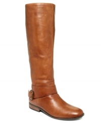 Tall and sleek. Nine West's Tip Top riding boots feature a buckled strap that stretches around the ankle and small stacked heel.