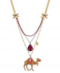 Get over the fashion hump. This Betsey Johnson three-row pendant necklace is detailed with a gold tone camel with crystal accents, glitter detail, fuchsia crystal cup chain, purple teardrop and gold tone bows. Crafted in antiqued gold tone mixed metal. Approximate length: 16 inches + 3-inch extender. Approximate drop: 3-3/4 inches. Get over the fashion hump. This Betsey Johnson three-row pendant necklace is detailed with a gold tone camel with crystal accents, glitter detail, fuchsia crystal cup chain, purple teardrop and gold tone bows. Crafted in antiqued gold tone mixed metal. Approximate length: 16 inches + 3-inch extender. Approximate drop: 3-3/4 inches.
