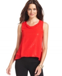 A sequined underlay and sheer layer on top gives this NY Collection blouse subtle shimmer. A sequined underlay and sheer layer on top gives this NY Collection blouse subtle shimmer.