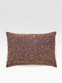 A rustic, wholly exotic pillow is defined by wood beads that add depth and texture wherever you place it.12 X 16Beaded cottonSpot cleanImported