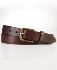 A slim leather belt is embellished with an antiqued brass buckle for a classic, timeworn aesthetic. A slim leather belt is embellished with an antiqued brass buckle for a classic, timeworn aesthetic.