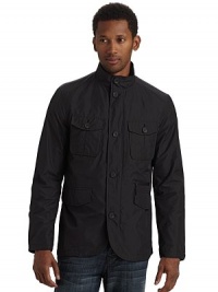 A stylish way to conquer the elements, this waterproof design keeps you dry and comfortable with roomy exterior pockets for increased functionality.Stand collar Front zipper with button storm flap Long sleeves with button cuffs Dual button flap pockets One zip pocket Dual flap pockets Two inside zip pockets Partially lined About 27½ from shoulder to hem Polyester Hand wash Imported A stylish way to conquer the elements, this waterproof design keeps you dry and comfortable with roomy exterior pockets for increased functionality.Stand collar Front zipper with button storm flap Long sleeves with button cuffs Dual button flap pockets One zip pocket Dual flap pockets Two inside zip pockets Partially lined About 27½ from shoulder to hem Polyester Hand wash Imported
