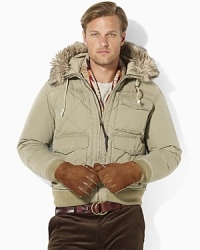 Delivering lightweight warmth in quilted cotton poplin, the Williston jacket is finished with a plush down filling and luxe faux-coyote trim at the hood. Delivering lightweight warmth in quilted cotton poplin, the Williston jacket is finished with a plush down filling and luxe faux-coyote trim at the hood.