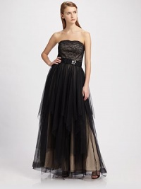 An exquisite design, this strapless style has multiple tiers of fine mesh on the skirt.Sweetheart neckline Lace bodice Rhinestones on wide bow belt Full, multi-layered skirt Back zipper About 57 from top to hem Polyester Dry clean Imported An exquisite design, this strapless style has multiple tiers of fine mesh on the skirt.Sweetheart neckline Lace bodice Rhinestones on wide bow belt Full, multi-layered skirt Back zipper About 57 from top to hem Polyester Dry clean Imported
