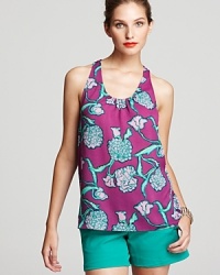 Popping with petals, this Lilly Pulitzer top infuses your everyday style with unabashed feminine charm as decadent ruffles team up with vibrant florals. Popping with petals, this Lilly Pulitzer top infuses your everyday style with unabashed feminine charm as decadent ruffles team up with vibrant florals.