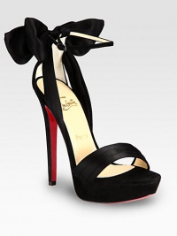 Get tangled up in this satin silhouette with an adjustable ankle strap and suede platform, backed by an unexpected bow. Suede-covered heel, 5½ (140mm)Covered platform, 1 (25mm)Compares to a 4½ heel (115mm)Satin and suede upperAdjustable ankle strapLeather liningSignature red leather solePadded insoleMade in Italy Get tangled up in this satin silhouette with an adjustable ankle strap and suede platform, backed by an unexpected bow. Suede-covered heel, 5½ (140mm)Covered platform, 1 (25mm)Compares to a 4½ heel (115mm)Satin and suede upperAdjustable ankle strapLeather liningSignature red leather solePadded insoleMade in Italy