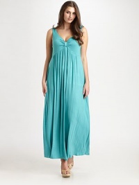 A flattering twist-front neckline leads to a gorgeous draped bodice creating a romantic ankle-grazing design.V-neckSleevelessPull-on styleAbout 42 from natural waist92% rayon/8% spandexDry cleanMade in USA of imported fabric A flattering twist-front neckline leads to a gorgeous draped bodice creating a romantic ankle-grazing design.V-neckSleevelessPull-on styleAbout 42 from natural waist92% rayon/8% spandexDry cleanMade in USA of imported fabric