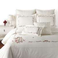 A delicate floral border adds classic charm to this duvet set, featuring two shams, two decorative pillows and a lushly flowing bedskirt. A delicate floral border adds classic charm to this duvet set, featuring two shams, two decorative pillows and a lushly flowing bedskirt.