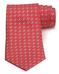 A silk tie adds distinction to your formal presentation. With a repeating pattern of interlocked Gancini logos, you'll also punch up your attire with the designer's signature flair. A silk tie adds distinction to your formal presentation. With a repeating pattern of interlocked Gancini logos, you'll also punch up your attire with the designer's signature flair.