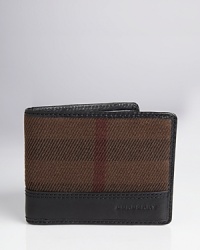 Crafted with luxe leather accents and a printed design detail, this Burberry wallet is build to hold your cards and bills in style. Crafted with luxe leather accents and a printed design detail, this Burberry wallet is build to hold your cards and bills in style.