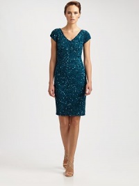 Sparkling beads add a glamorous touch to this sartorial accomplishment.V-necklineCap sleevesAllover sequinsConcealed back zipperFully linedAbout 22 from natural waistNylonDry cleanImported Model shown is 5'10 (177cm) wearing US size 4. Sparkling beads add a glamorous touch to this sartorial accomplishment.V-necklineCap sleevesAllover sequinsConcealed back zipperFully linedAbout 22 from natural waistNylonDry cleanImported Model shown is 5'10 (177cm) wearing US size 4.