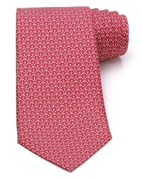 A hole in one! This classic silk tie from Salvatore Ferragamo shows off a playful golfball and tee print. A hole in one! This classic silk tie from Salvatore Ferragamo shows off a playful golfball and tee print.
