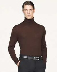 A trim turtleneck sweater is expertly crafted from indulgent Italian cashmere for an equally sumptuous look and feel. A trim turtleneck sweater is expertly crafted from indulgent Italian cashmere for an equally sumptuous look and feel.