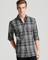 A check-printed cotton sport shirt boasts a classic color palette and a slim fit. A check-printed cotton sport shirt boasts a classic color palette and a slim fit.