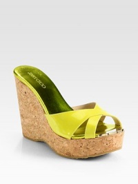 Bands of glossy patent leather interlace atop this cork wedge, finished with reflective metallic leather and metal accents. Cork wedge, 4½ (115mm)Cork platform, 1½ (40mm)Compares to a 3 heel (75mm)Patent leather upperMetallic leather lining with metal insert detailRubber solePadded insoleMade in Spain Bands of glossy patent leather interlace atop this cork wedge, finished with reflective metallic leather and metal accents. Cork wedge, 4½ (115mm)Cork platform, 1½ (40mm)Compares to a 3 heel (75mm)Patent leather upperMetallic leather lining with metal insert detailRubber solePadded insoleMade in Spain